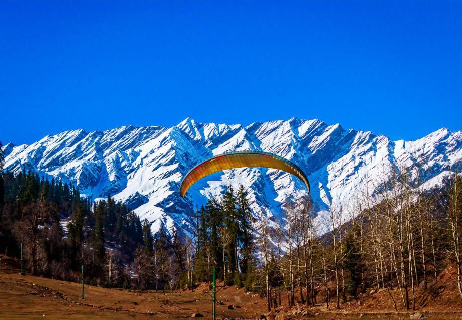 Adventure seekers enjoy thrilling activities in the breathtaking landscape of Manali.
