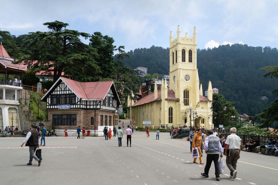 Things to do in Shimla: Exploring the serene beauty of Mall Road on a leisurely evening stroll with the Himalayan mountains as your backdrop.