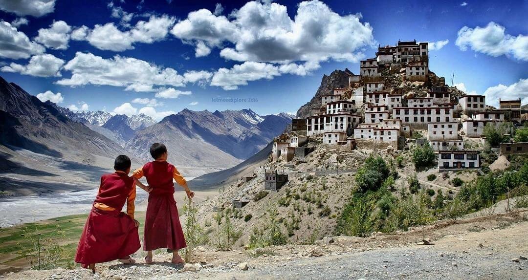 Best Places to Visit in Spiti Valley: A breathtaking view of the Spiti River winding through the rugged Himalayan terrain, with snow-capped peaks in the distance. Nature's masterpiece in the heart of Himachal Pradesh, India.